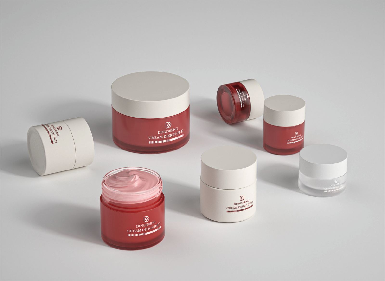 Cream jars in red, white, and clear